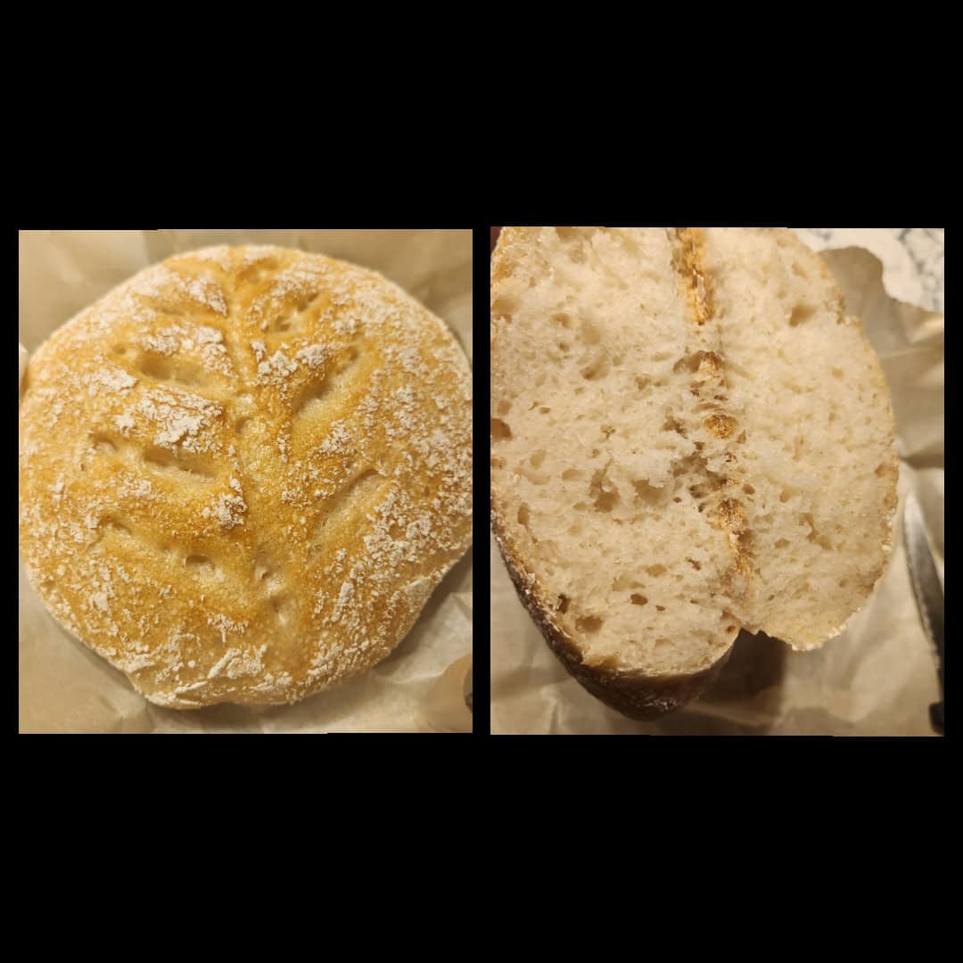 A round loaf of sourdough bread with a leaf-shaped pattern on top is shown in a split image. The left side displays the whole loaf, while the right side reveals the interior, highlighting the soft crumb and crusty texture.