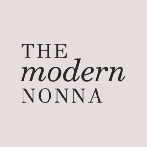 Text logo reading "THE modern NONNA" in black letters on a light beige background. The word "modern" is in italic font, while the other words are in regular, all-capital letters.