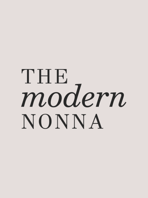 Text logo reading "THE modern NONNA" in black letters on a light beige background. The word "modern" is in italic font, while the other words are in regular, all-capital letters.