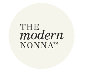 Logo with the words “THE modern NONNA™” in black serif font, centered on a pale cream circular background.