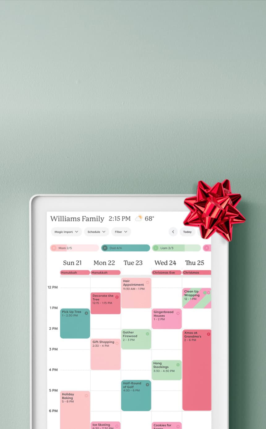 A digital family calendar displayed on a tablet shows a weekly schedule with color-coded events and an attached red gift bow, set against a pale green backgroundโperfect for staying organized and discovering exclusive deals.