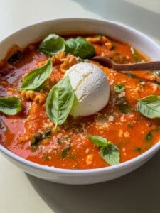 High fibre lasagna soup in a bowl with a dollop of ricotta on top