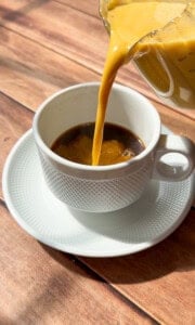 Pumpkin Creamer being poured into white cup