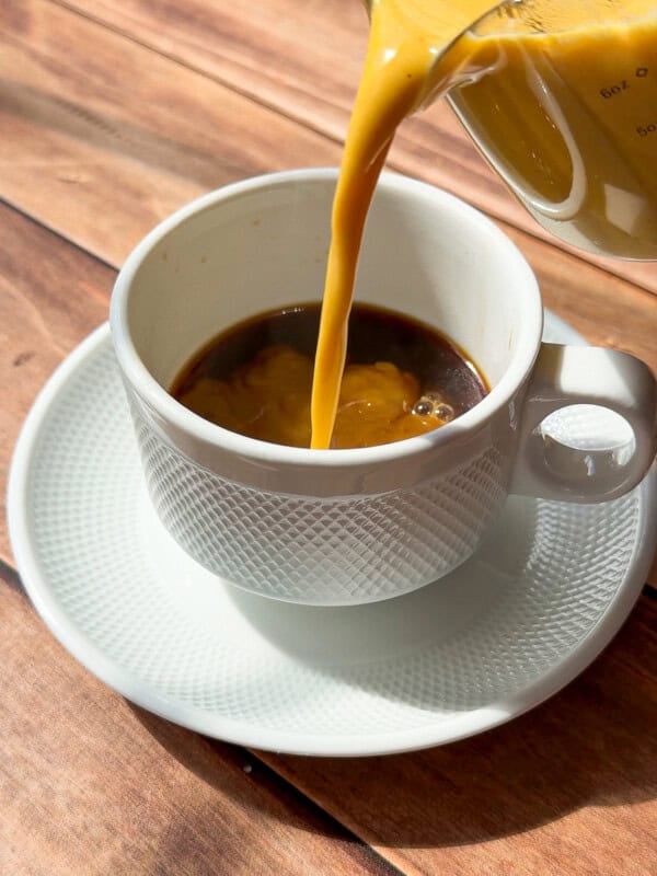 Pumpkin Creamer being poured into white cup