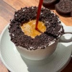 Espresso poured into Oreo cookie-rimmed coffee cup