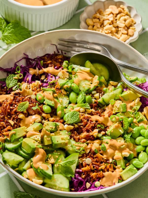 Vibrant rice bowl with avocado, edamame, and peanut sauce