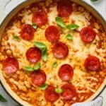 Pepperoni pizza pasta bake in a white skillet