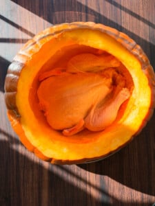 whole chicken inside a cleaned out pumpkin